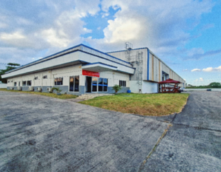 Modern warehouse building and driveway