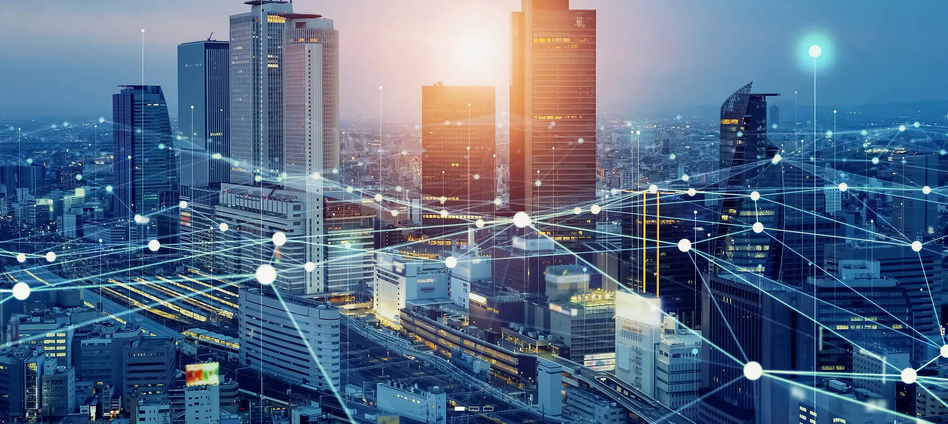 Modern cityscape at sunset with technology overlay